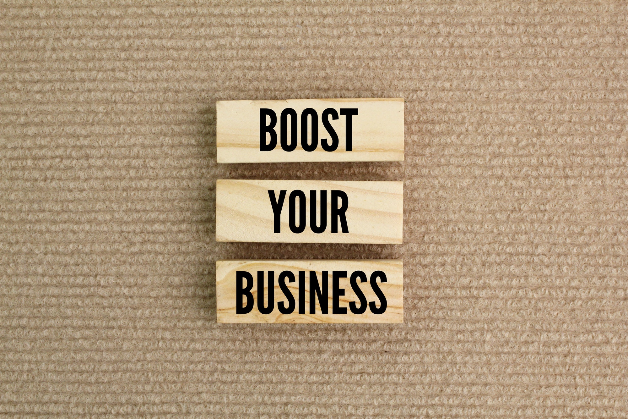sticks arranged with the words boost your business.